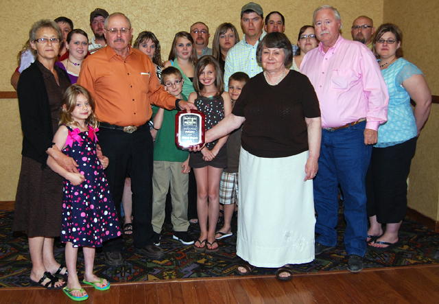 The family of the late Gilbert Wagner, Reliance, accepted the plaque to honor Gilbert's induction into the South Dakota Auctioneers Hall of Fame. Gilbert's children, Mark and Kathleen are shown holding the plaque. 