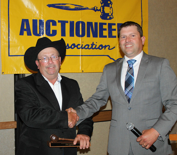 Ben Meyer presenting gavel to out-going President Val Luckett